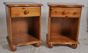 2 contemporary pine bedside cabinets. The bun feet having open storage with short drawers above
