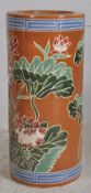 A Chinese famille rouge stick stand painted with ochre background and decorative scenes