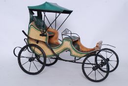 A 20th century model horse drawn cart made of cast metal frame, with wooden made carriage body and