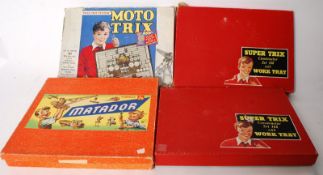 A collection of vintage construction toys / games, several sets including Moto Trix and Super