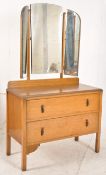 A 1930's Oak Art Deco dressing table chest of drawers. Raised on squared legs with a body of 2