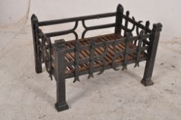 A cast iron vintage fire basket in the gothic style. All raised over square supports