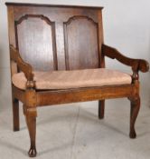 19th century Georgian country oak hall settle / bench. Raised on cabriole legs with pad feet