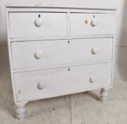 A Victorian painted pine cottage 2 over 2 chest of drawers. Bun feet with porcelain handles to