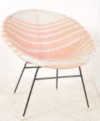 A 1950's retro tubular metal atomic style pink and white bedroom armchair. Raised on black metal