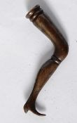 An antique Georgian cast metal pipe tamper in the form of a Georgian leg. 5cm in length.