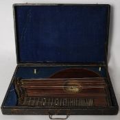 A 19th century Austrian rosewood zither by Wilhelm Riedl, The rosewood body having ivory pegs with