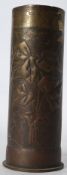 First World War brass trench art artillery shell being decorated in relief