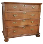 An early 18th century circa 1720 Jacobean oak chest of drawers. Raised on bun feet with 2 short over