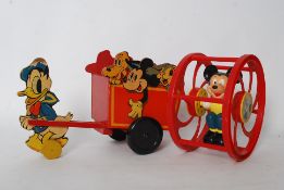 A retro Disney Mickey Mouse, Donald Duck pull along cart together with another retro Disney