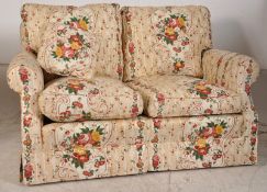 A  contemporary chintz upholstered twin seater chesterfield style cottage sofa in very good order,