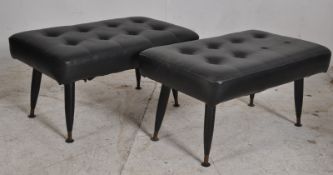 2 1970's retro black vinyl footstools. Ebonised tapered legs with button backed black vinyl