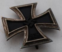 A 1939 Third Reich Nazi iron cross badge medal, with silver backing plate and frontal decoration and