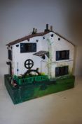 A vintage scratch built dolls house style model of a Watermill, with clockwork wheel (with key)