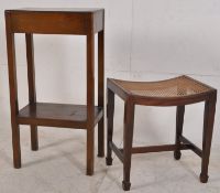An Edwardian mahogany tall lamp table having twin tiers. Together with an Edwardian mahogany bergere