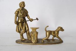 A 20th century brass statue of a blacksmith. Cast figure of a man with hammer alongside a