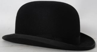 A Dunn and Co bowler hat size 7 1/4