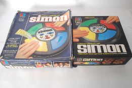 A vintage Milton Bradley Simon computer board game, being complete along with another Simon game,