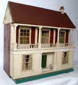 A 1920's Lines Brothers dolls house, with four rooms, hall, stairway, and complete with veranda.