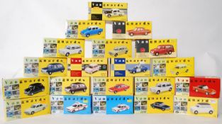 A large collection of Vanguards boxed diecast toy model cars including numbers: VA10006, VA56000,