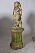 A good large garden statue of a cherub. Raised over a square plinth base, the cherub body having