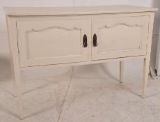 An Edwardian painted mahogany shabby chic hall cupboard / cabinet. Raised on squared legs having