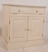 A painted pine shabby chic computer cabinet. Plinth base with double doors having fall front