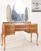 A good quality 1930's Queen Anne style dressing table / desk. Raised on cabriole legs with a