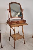 A Victorian mahogany toilet swing mirror raised over plinth base with scroll arms together with a