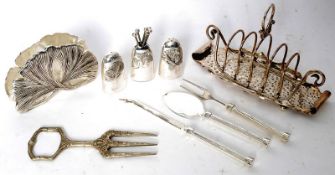 A collection of silver plate items to include toast rack, flatware, condiment shakers etc.