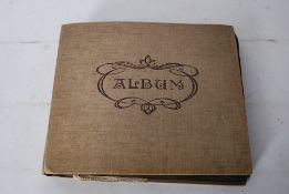 An early 20th century photograph album (circa 1918) containing cards, photographs and keepsakes from