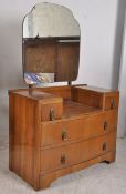 A 1930's Art Deco walnut drop centre dressing table. 2 short drawers over 2 deep drawers beneath