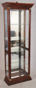A very good quality mahogany shop / antique display cabinet. The plinth base with glazed upright