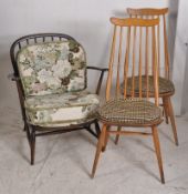 An Ercol low armchair together with a pair of 1970's Ercol Goldsmiths chairs.