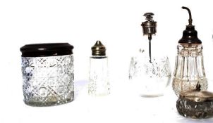 A hallmarked silver topped glass pot along with other white silver metal topped cut glass pots and