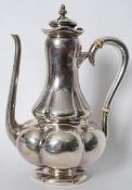 A silver American coffee pot weighing 17.3 Oz