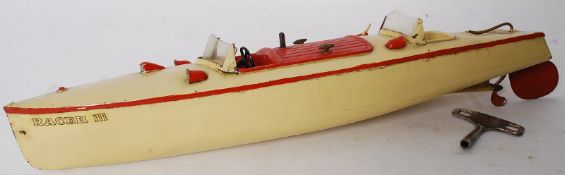 A vintage 1930's Hornby Meccano ' Racer III ' clockwork tinplate speedboat. In working order, with 2