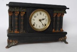 An American Sessions faux marble and slate columned mantel clock, with key and pendulum.