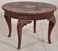 A 19th century Chinese chinoserie red laquer painted occasional table. Raised on shaped legs