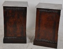 A pair of 19th Century mahogany bedside cabinets. Veined marble tops  over full length panelled