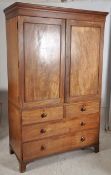 An early 19th century Georgian mahogany linen press. Raised on bracket feet with 2 short drawers