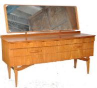 A Danish 1970's retro teak dressing table in the manner of Mogens Kolo. The low body having a