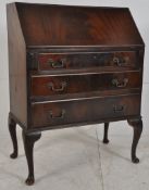 A 1930's flame mahogany queen anne bureau. Fall front slope having appointed interior over bank of