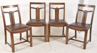 A set of 4 1930's Art Deco rail back dining chairs. The cup and cover legs united by stretchers