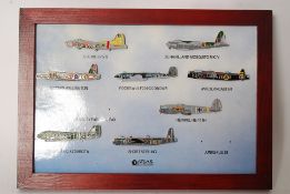 A collection of enamel badges of world war II aeroplanes mounted to board by Atlas Editions