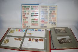 A good 20th century stamp album, filled with many examples along with two collectors albums of First