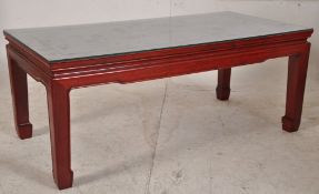 A Chinese hardwood rectangular coffee tabls.Raised on 4 shaped supports with chamfered details.