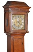 An 18th century oak longcase clock by Thomas Quested of Wye, circa 1750. The brass face with