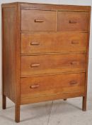 A good 1920's Arts & Crafts Heals type oak chest of drawers. Raised on square legs with a bank of
