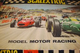 An original early Scalextric boxed set, with track, accessories and the two original cars